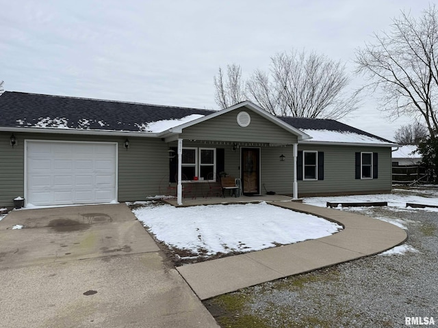 ranch-style house with a garage and covered porch