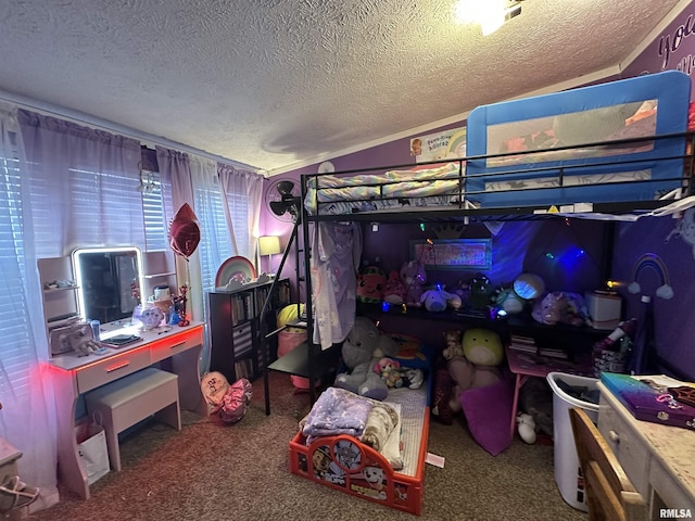 bedroom with carpet floors and a textured ceiling