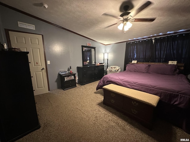 carpeted bedroom featuring ceiling fan, lofted ceiling, ornamental molding, and a textured ceiling