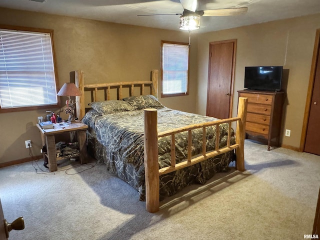 bedroom with ceiling fan and carpet floors