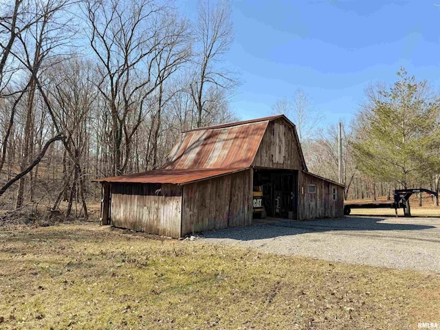 view of outbuilding with a yard