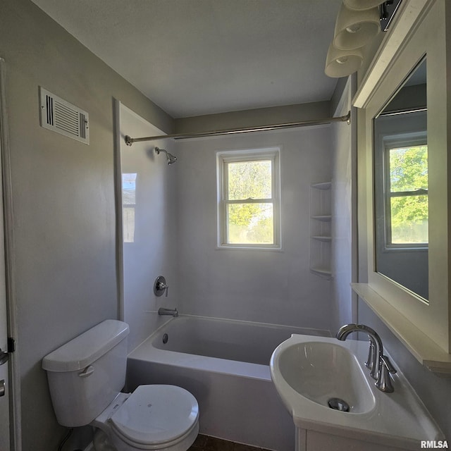 full bathroom featuring sink, toilet, shower / tub combination, and a healthy amount of sunlight