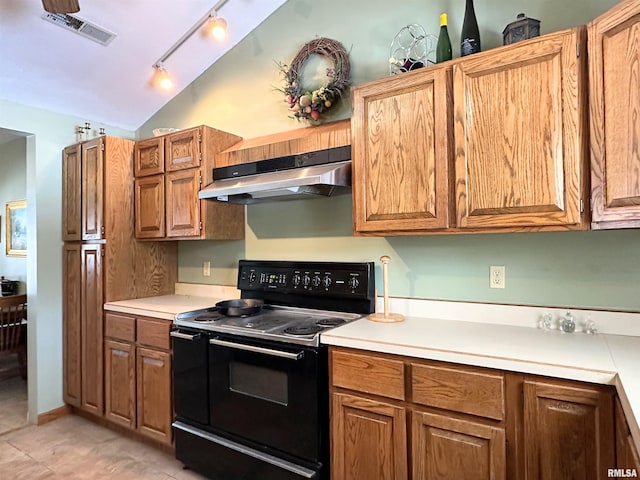 kitchen with light countertops, visible vents, black range with electric cooktop, under cabinet range hood, and lofted ceiling
