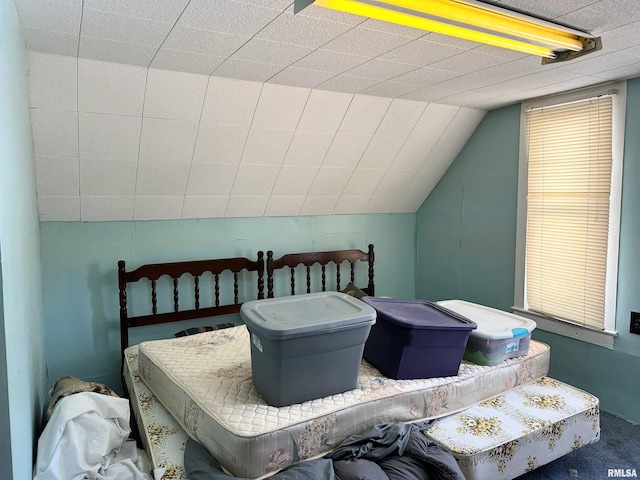bedroom with lofted ceiling