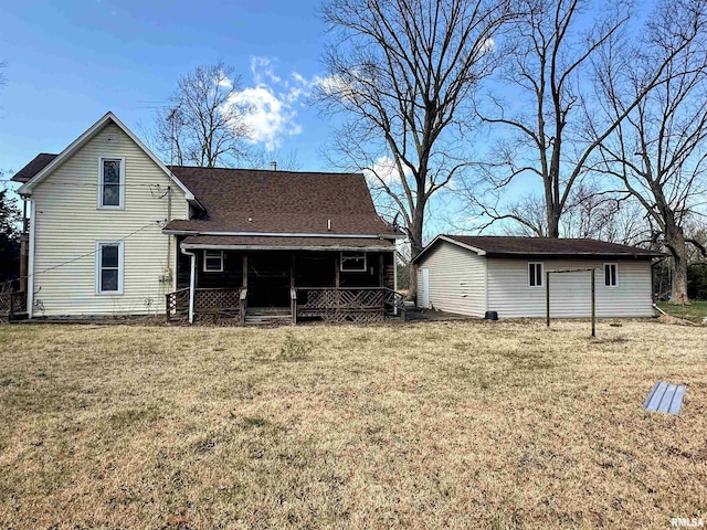 rear view of property with a yard