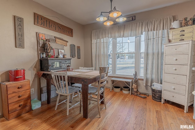 dining space featuring light wood-type flooring