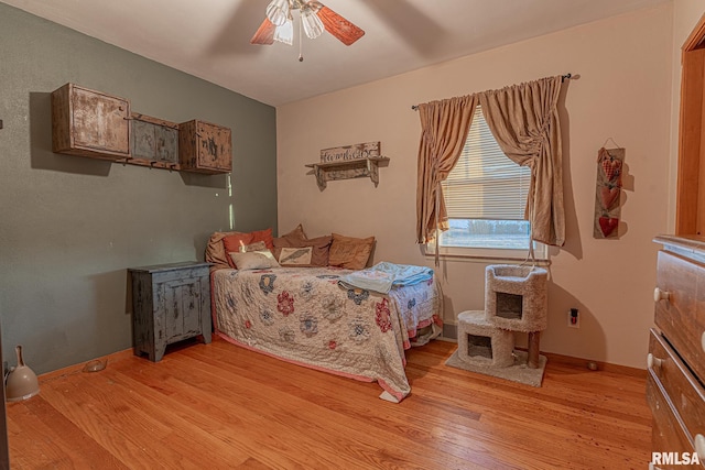 bedroom featuring ceiling fan and light hardwood / wood-style flooring