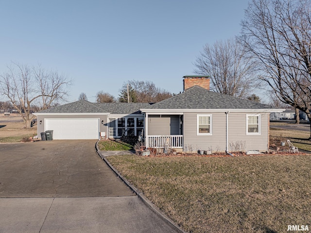 view of front facade featuring a front lawn, a porch, and a garage