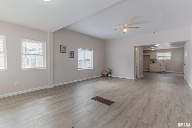 407 NW 6th St, Fairfield, IL 62837 - unfurnished living room with ceiling fan and light hardwood / wood-style flooring