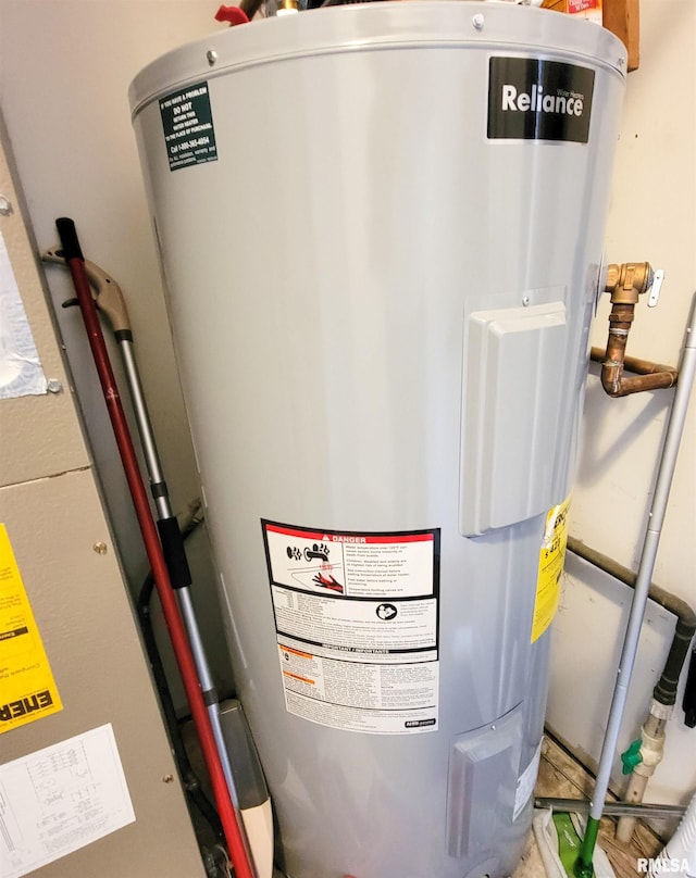 utility room featuring electric water heater