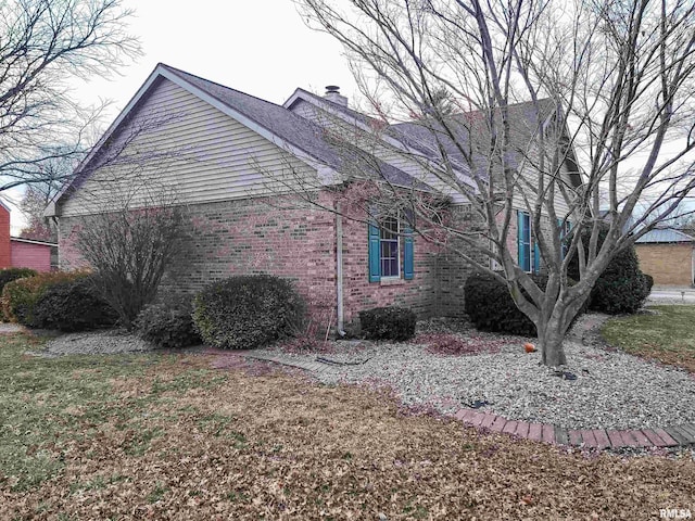 view of property exterior with a yard