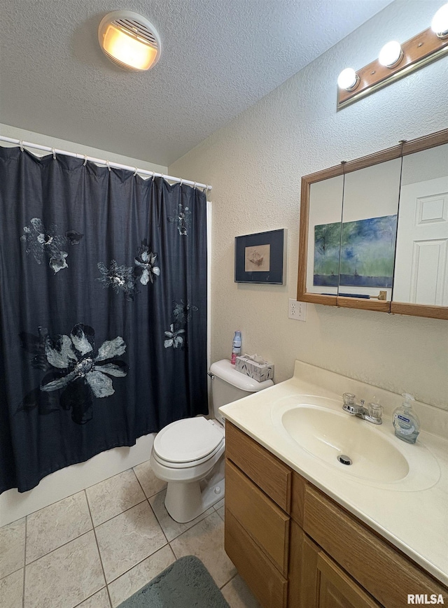 bathroom featuring tile patterned floors, a shower with curtain, toilet, a textured ceiling, and vanity