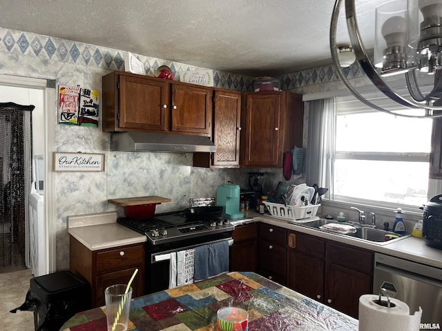 5 Evergreen Dr, Mount Vernon, IL 62864 - kitchen featuring wallpapered walls, light countertops, under cabinet range hood, a sink, and stainless steel appliances