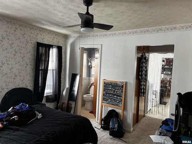 5 Evergreen Dr, Mount Vernon, IL 62864 - bedroom featuring a ceiling fan, a textured ceiling, ensuite bath, and wallpapered walls