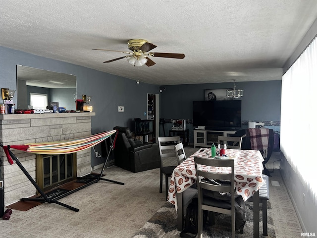 5 Evergreen Dr, Mount Vernon, IL 62864 - dining area featuring ceiling fan with notable chandelier, carpet flooring, and a textured ceiling