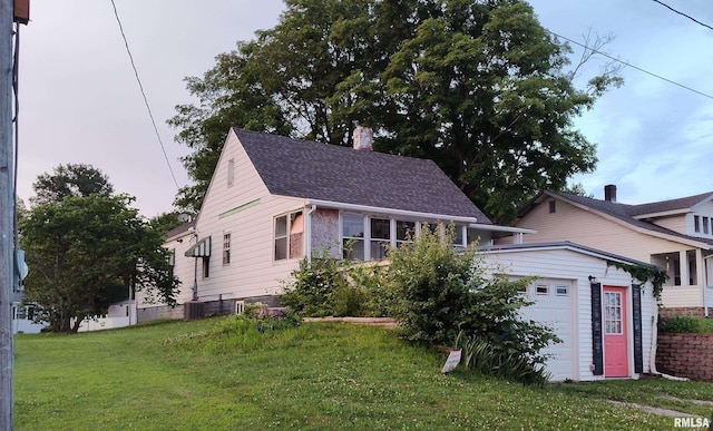 514 W Randolph St, Mcleansboro, IL 62859 - view of front of home featuring a chimney, a front lawn, and a shingled roof
