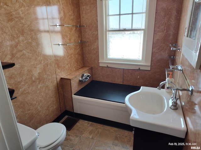 bathroom featuring toilet and vanity