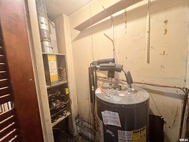 utility room featuring water heater