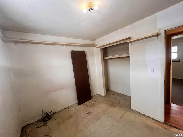 unfurnished bedroom featuring a closet