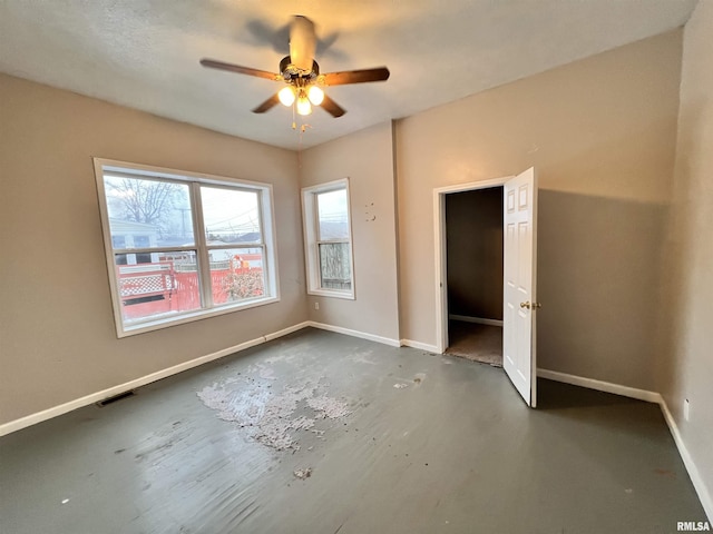 unfurnished bedroom featuring ceiling fan