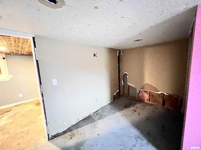 empty room with a textured ceiling