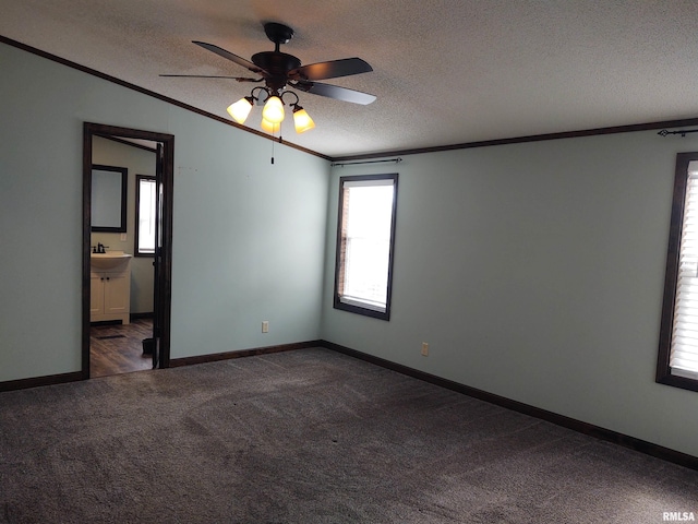 85 Bethlehem Church Ln, Vienna, IL 62995 - unfurnished room featuring baseboards, a ceiling fan, dark colored carpet, a textured ceiling, and crown molding