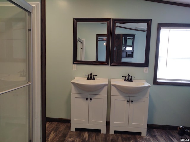 85 Bethlehem Church Ln, Vienna, IL 62995 - bathroom featuring a stall shower, wood finished floors, baseboards, and double vanity