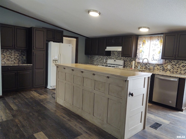 85 Bethlehem Church Ln, Vienna, IL 62995 - kitchen with white appliances, lofted ceiling, dark wood-style flooring, a center island, and under cabinet range hood