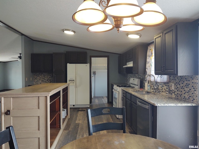 85 Bethlehem Church Ln, Vienna, IL 62995 - kitchen featuring under cabinet range hood, white appliances, a sink, vaulted ceiling, and light countertops