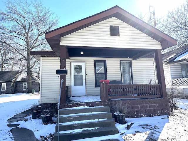 shotgun-style home with covered porch