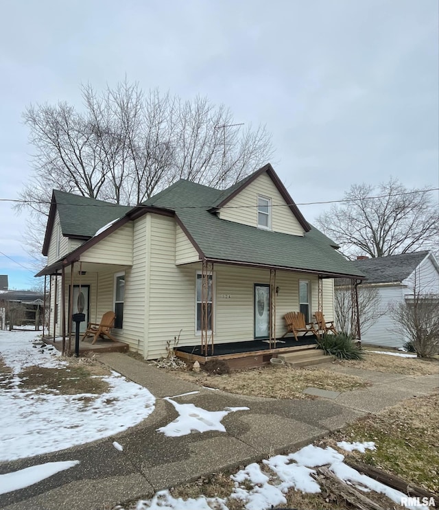 view of front of house featuring a porch and roof with shingles