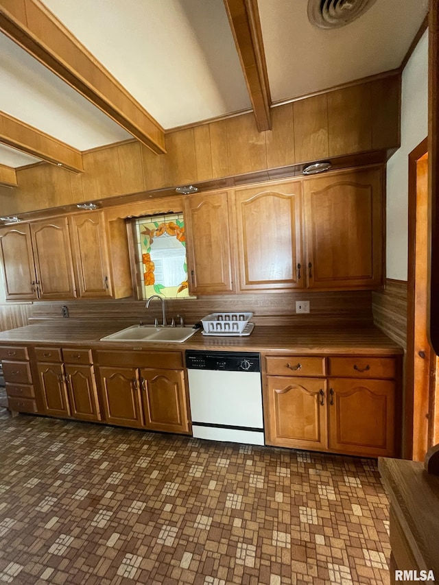 kitchen featuring white dishwasher, a sink, and brown cabinets