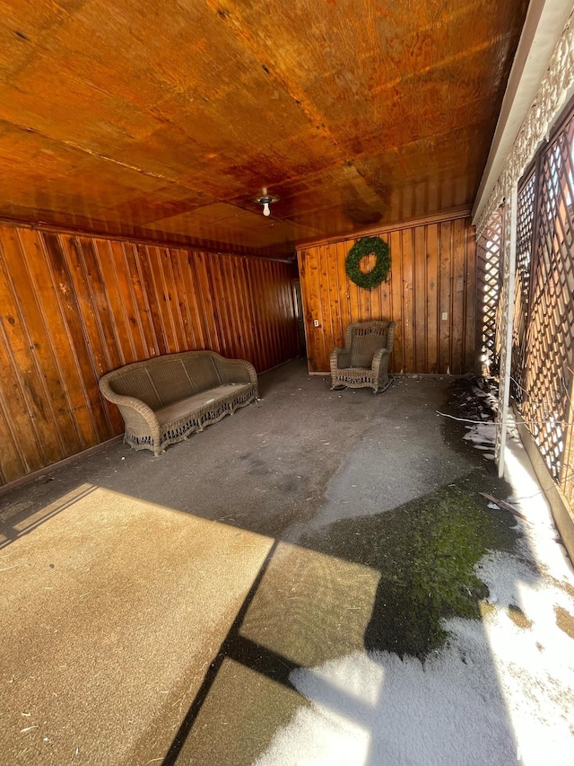 interior space with wood ceiling and wooden walls