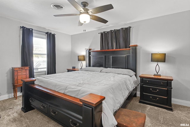 bedroom with carpet floors, baseboards, visible vents, and a ceiling fan