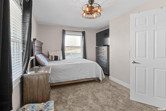 carpeted bedroom with baseboards