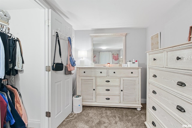 spacious closet with carpet flooring