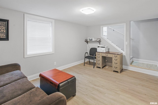 office featuring baseboards and wood finished floors