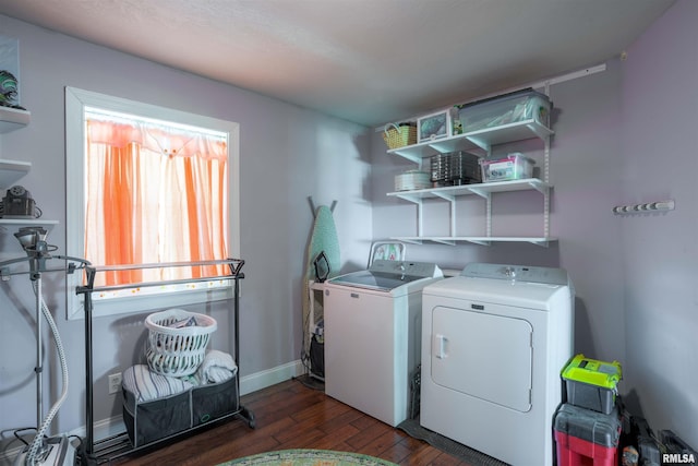 laundry room with baseboards, independent washer and dryer, hardwood / wood-style floors, and laundry area