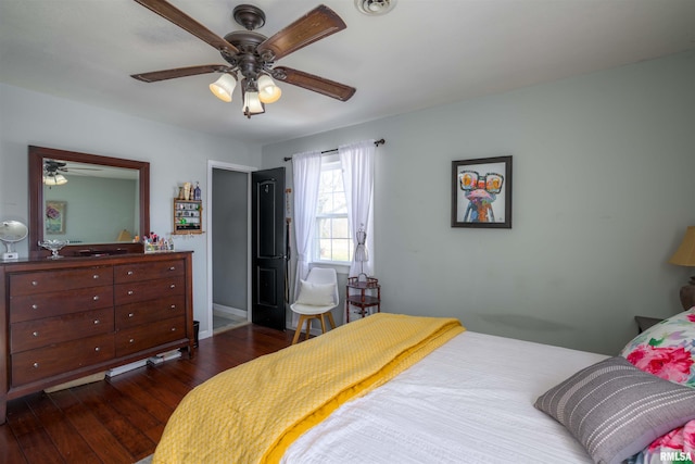 bedroom featuring ceiling fan and dark wood-style floors