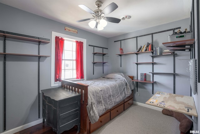 bedroom with visible vents, a ceiling fan, and baseboards