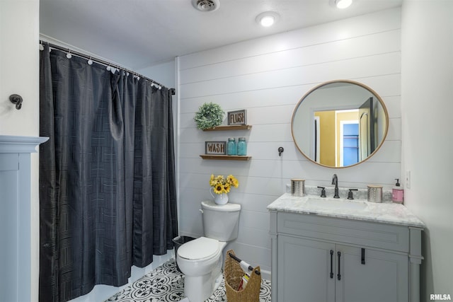 bathroom featuring vanity, curtained shower, toilet, and visible vents