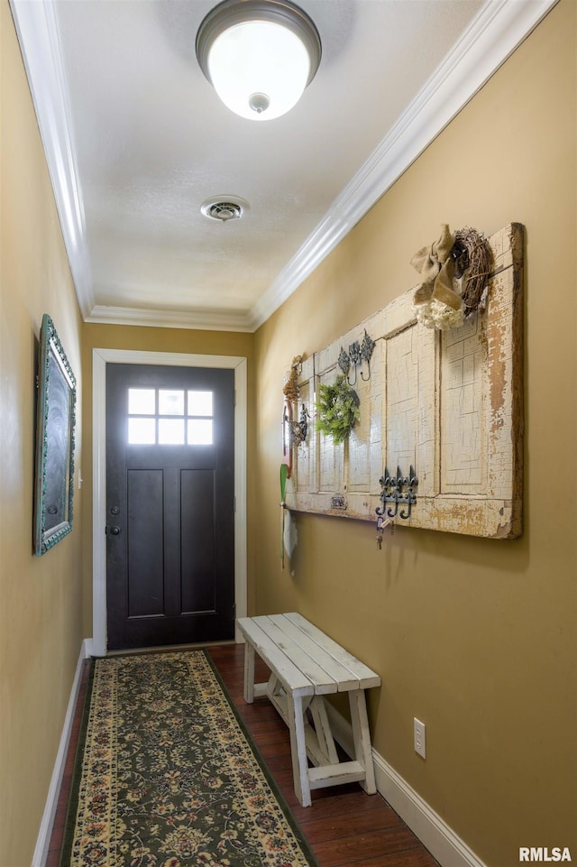 doorway to outside with dark wood-type flooring, baseboards, visible vents, and ornamental molding