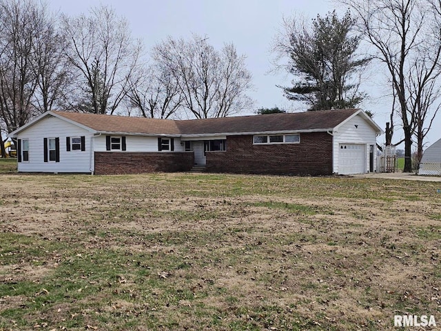 single story home featuring a front lawn and a garage