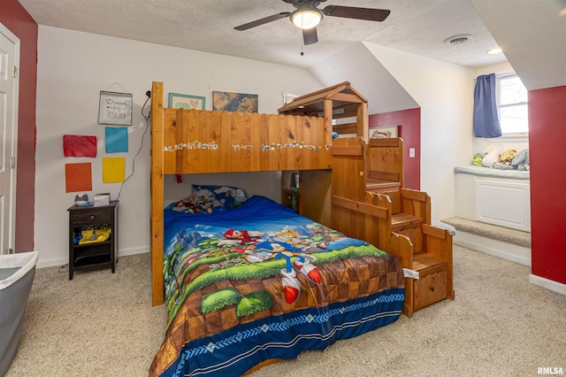 bedroom featuring baseboards, visible vents, a ceiling fan, a textured ceiling, and carpet floors