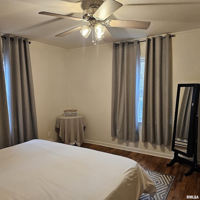 bedroom featuring ceiling fan and dark wood-type flooring