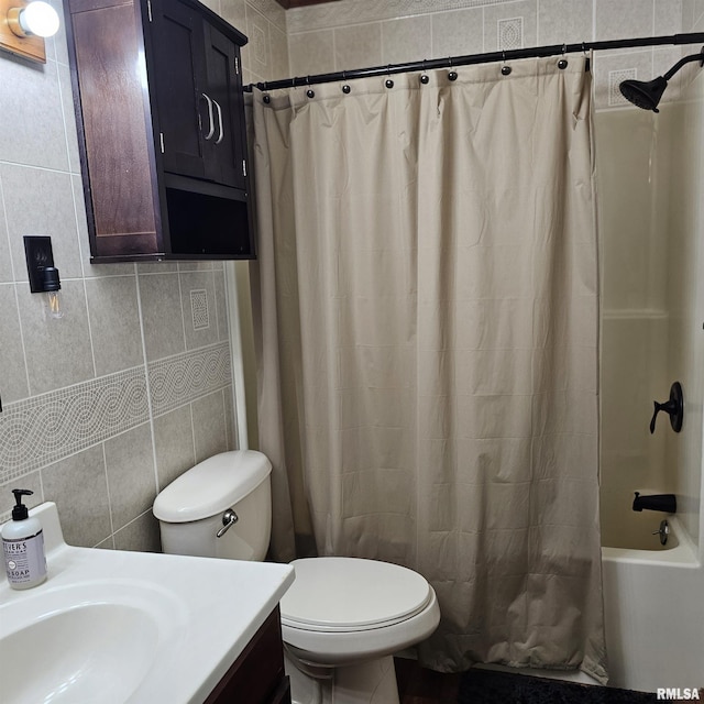 full bath featuring toilet, vanity, tile walls, and shower / bathtub combination with curtain