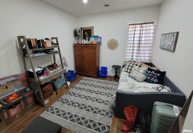 interior space with dark wood-style floors, visible vents, and recessed lighting