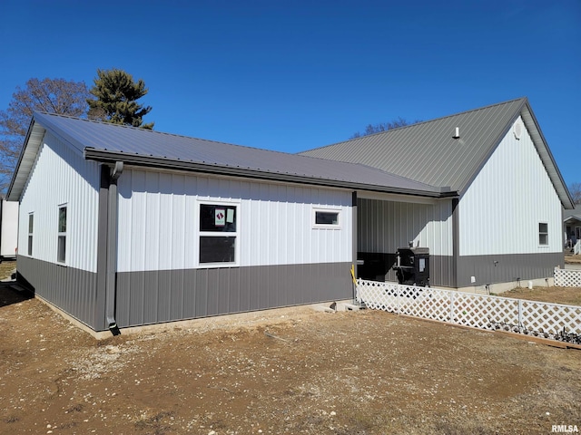 view of property exterior with metal roof