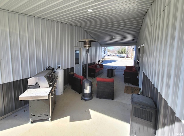 view of patio / terrace with heating unit, outdoor lounge area, and area for grilling