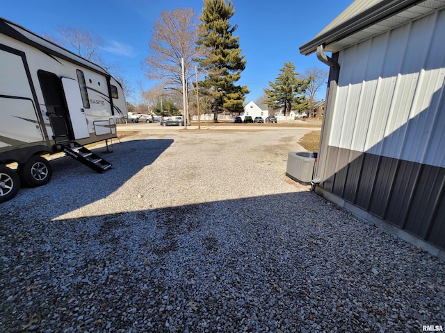 view of yard featuring central air condition unit